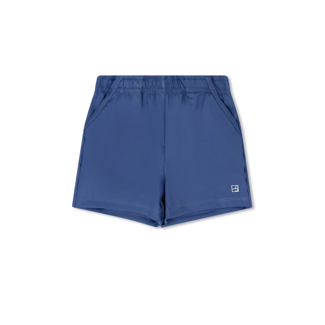 A pair of slate blue athletic shorts with an elastic waistband and a small white logo on the lower left hem, displayed flat against a solid white background.