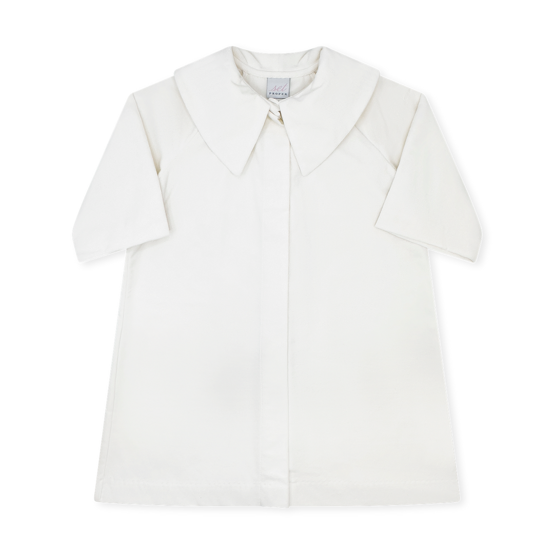 An off-white short-sleeve collared shirt with a button-down front, displayed flat against a solid white background.