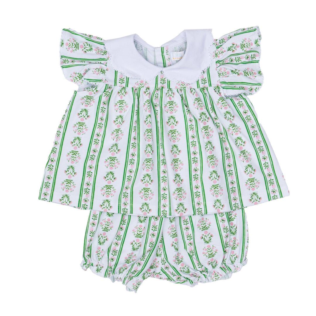 Green and white baby romper with floral pattern on a white background