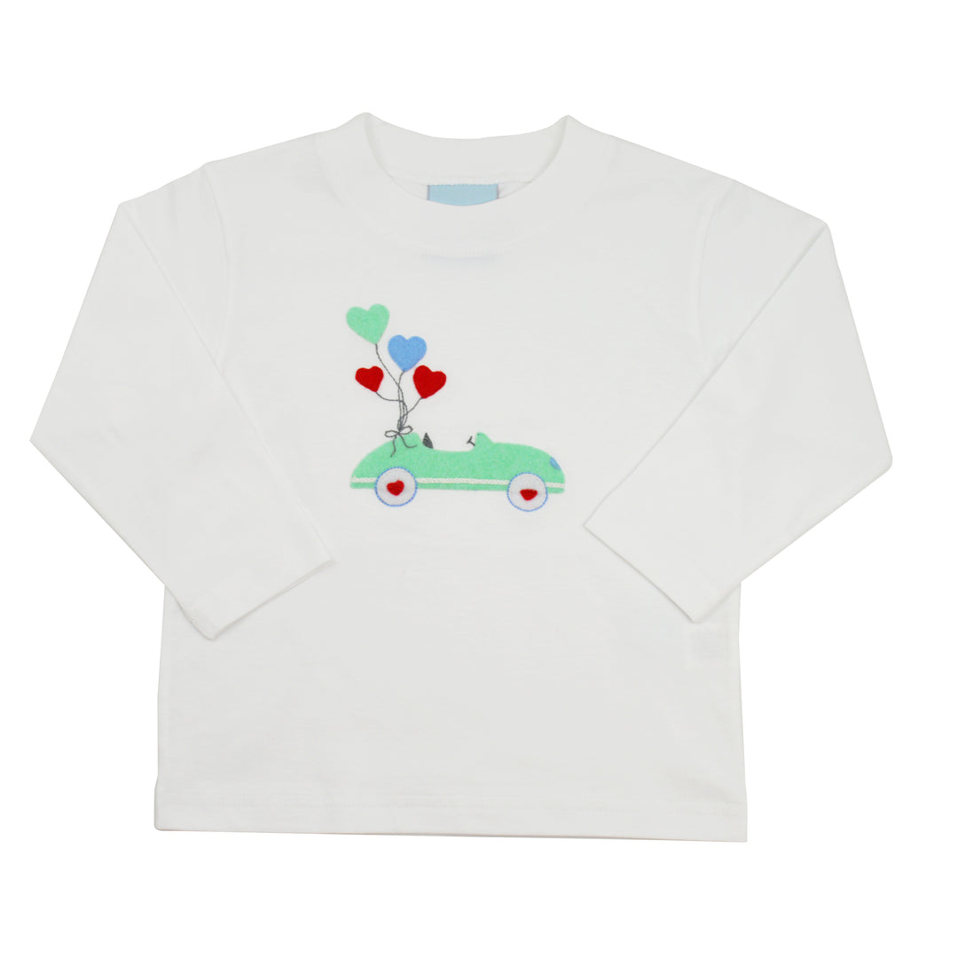 White long-sleeve shirt with a car and heart balloon design on a white background