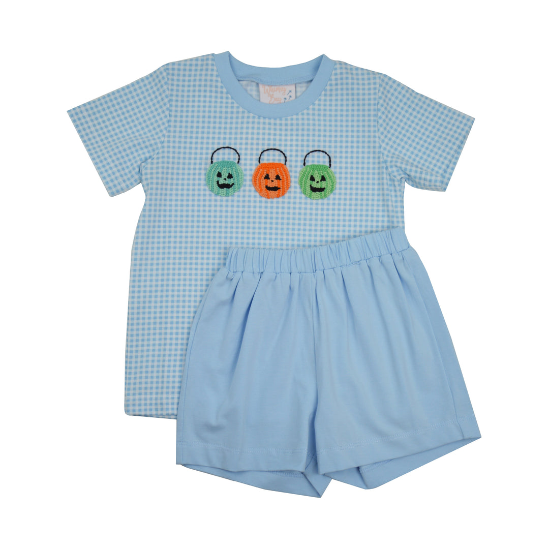 A baby boy's two-piece outfit featuring a light blue and white gingham short-sleeve t-shirt with three embroidered jack-o'-lantern candy baskets on the chest, paired with matching light blue shorts.