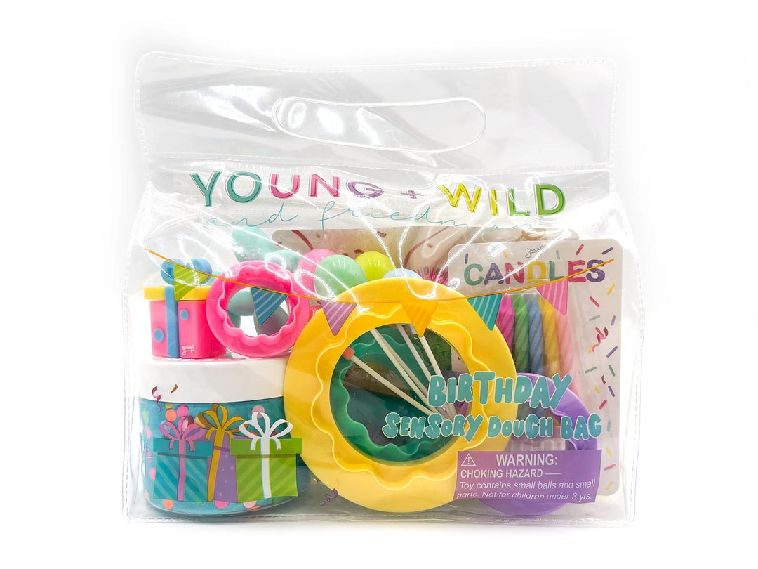 Packaged birthday supplies with colorful candles and decorations on a white background