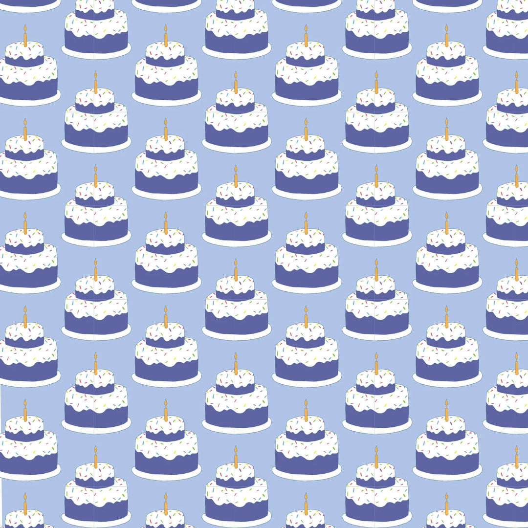 Pattern of blue and white cakes with candles on a blue background