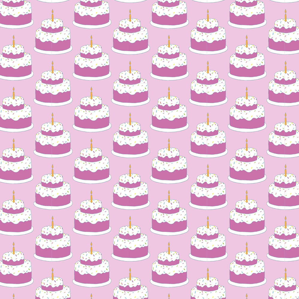 Pattern of pink cakes with white frosting and candles on a pink background