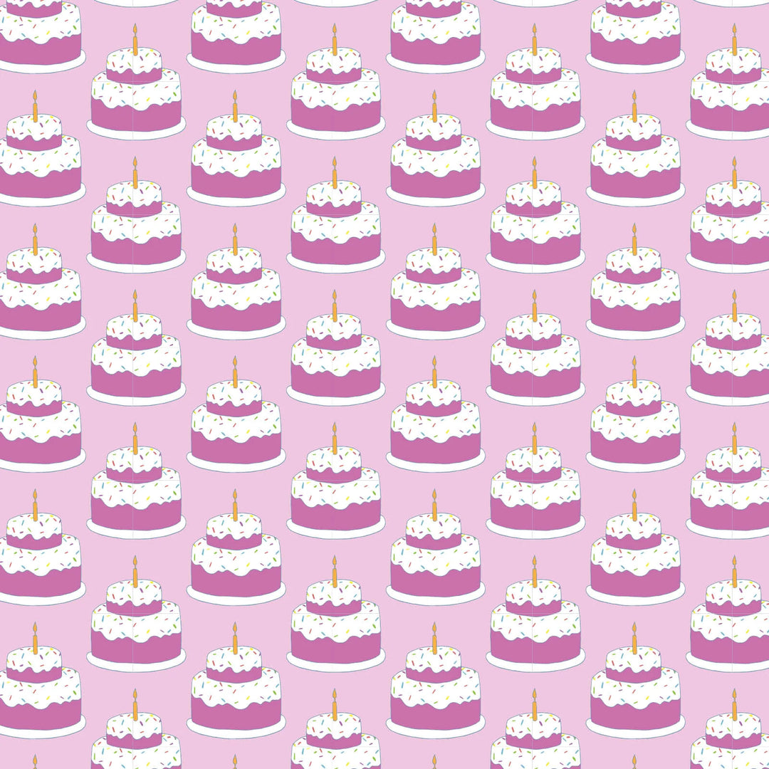 Pattern of pink cakes with white frosting and candles on a pink background