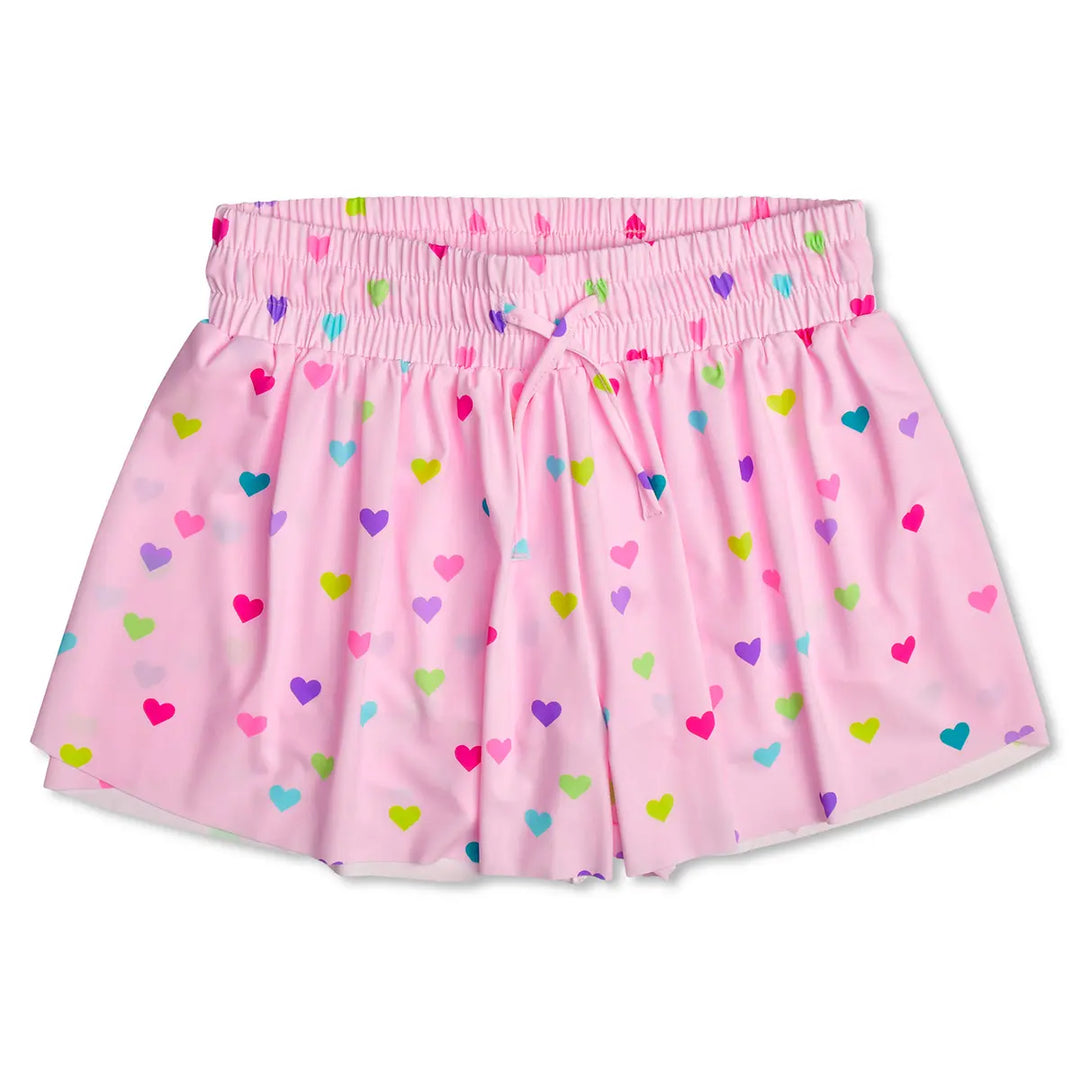 Pink athletic shorts with colorful heart pattern on a white background